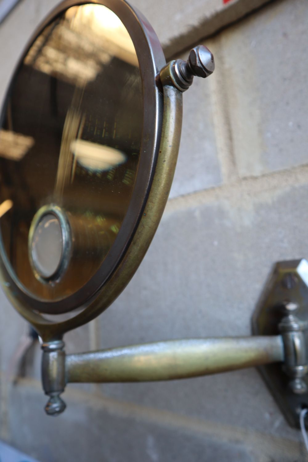 An Art Deco shaving mirror, plate 24cm diameter